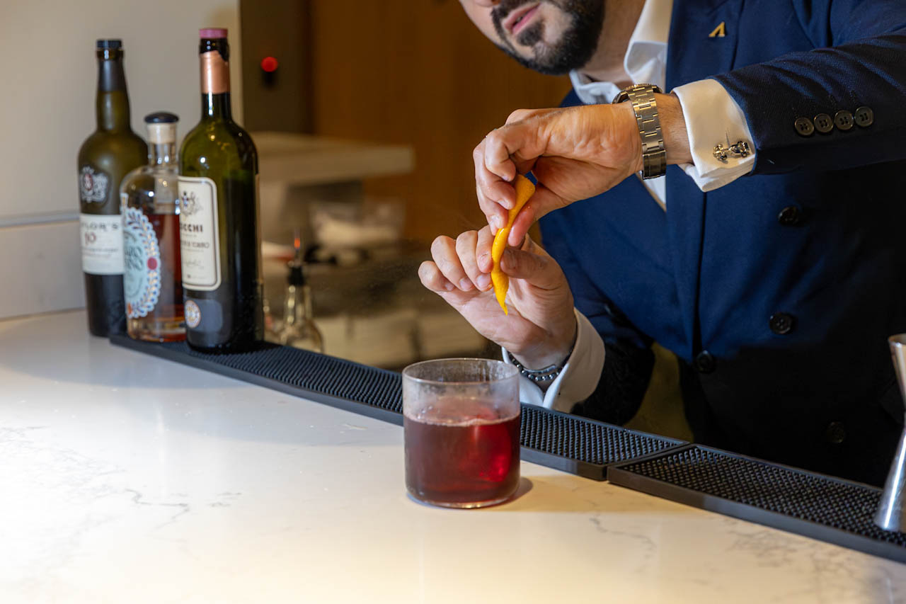 A bartender preparing cocktails for the guests