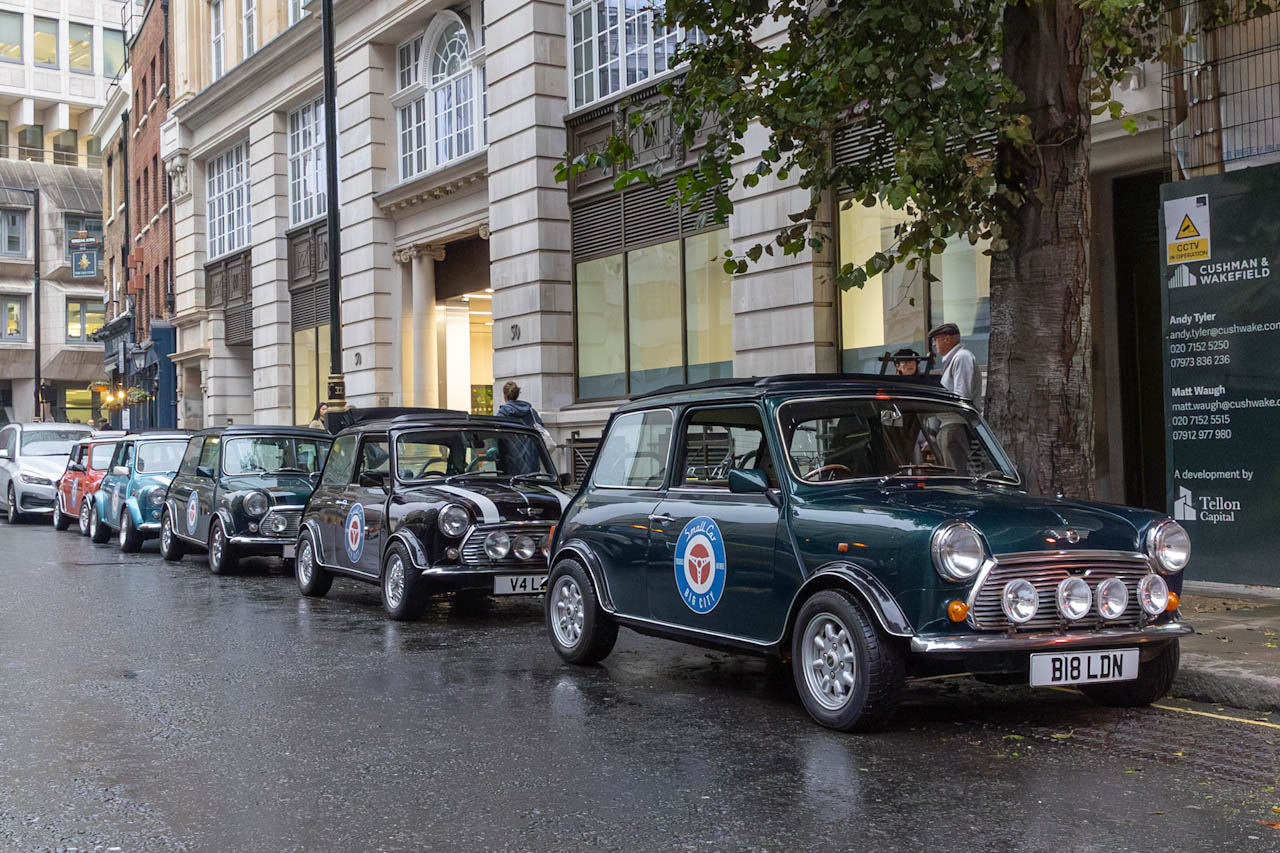 Classic Mini Coopers lined up for the London driving tour